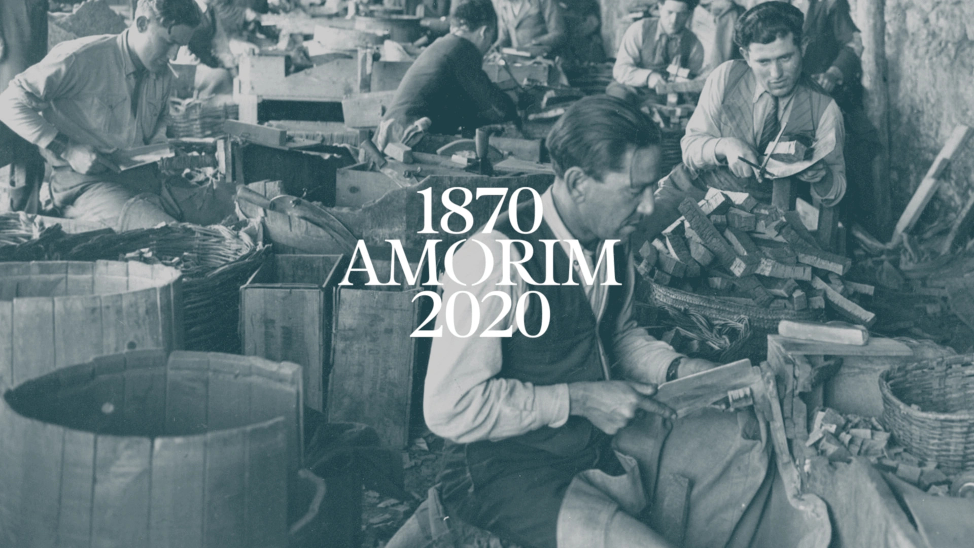 Image taken from the Amorim motion film, an old photography of people working with cork. The logo celebrating the 150 anniversary of Amorim is in the center: 1870 Amorim 2020.